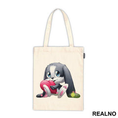 Bunny Sitting On And Holding A Heart - Životinje